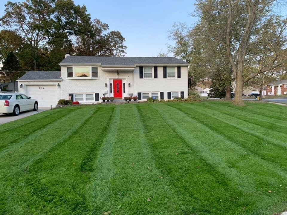 South Jersey home with a freshly striped green lawn